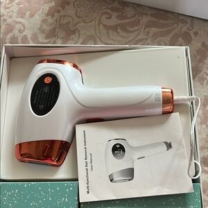 Source Unknown White and Copper Hair Removal Device